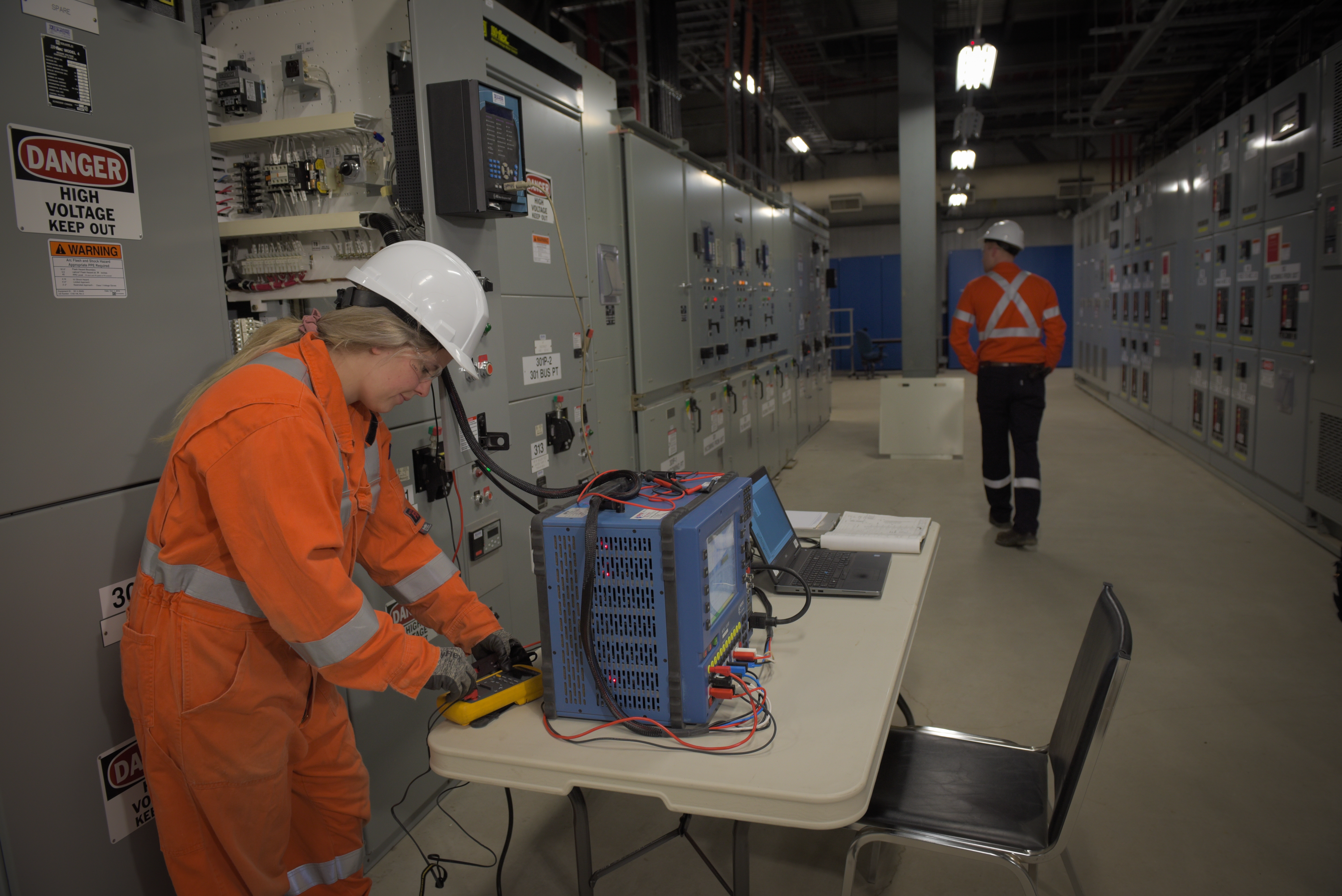 Dynamo employee using diagnostic instrumentation to run diagnostic check before performing shutdown.